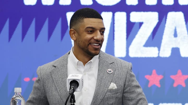 Jan 9, 2026; Washington, District of Columbia, USA; Washington Wizards general manager Will Dawkins (L) introduces newly acquired Wizards guard Trae Young (R) at a press conference prior to the Wizards' game against the New Orleans Pelicans at Capital One Arena. Mandatory Credit: Geoff Burke-Imagn Images