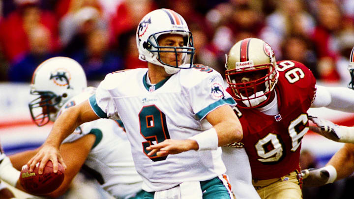Andre Carter closes in on Miami quarterback Jay Fiedler 