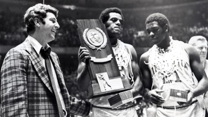 Mar 29, 1976; Philadelphia, PA, USA; FILE PHOTO; Indiana head coach Bobby Knight celebrates with forward Scott May (center) and guard Quinn Buckner (21) after winning the 1976 NCAA basketball championship. The Hoosiers beat the Wolverines 86-68.