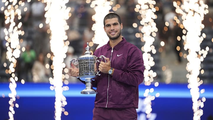 Sep 7, 2025; Flushing, NY, USA; Carlos Alcaraz (ESP) holds the trophy after defeating Jannik Sinner (ITA) in the final of men's singles at Billie Jean King National Tennis Center.