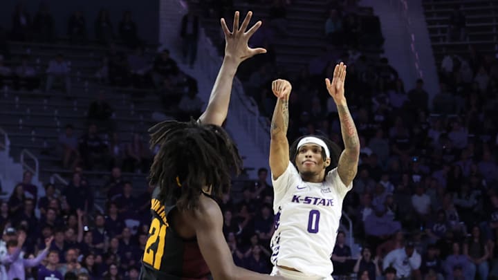 Feb 23, 2025; Manhattan, Kansas, USA; Kansas State Wildcats guard Dug McDaniel (0) shoots against Arizona State Sun Devils guard Alston Mason (1) during the second half at Bramlage Coliseum. Mandatory Credit: Scott Sewell-Imagn Images