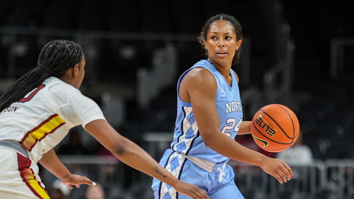 Oct 30, 2025; Atlanta, GA, USA; North Carolina Tar Heels guard Indya Nivar (24) looks for the play against South Carolina Gamecocks guard Ta'Niya Latson (00) during the first quarter at State Farm Arena. Mandatory Credit: Jordan Godfree-Imagn Images Oct 30, 2025; Atlanta, GA, USA; North Carolina Tar Heels guard Indya Nivar (24) looks for the play against South Carolina Gamecocks guard Ta'Niya Latson (00) during the first quarter at State Farm Arena. Mandatory Credit: Jordan Godfree-Imagn Images