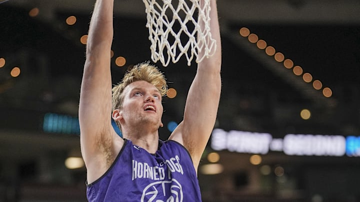 Mar 18, 2026; Greenville, SC, USA; Texas Christian University Horned Frogs center Adam Stewart (22) dunks during a practice session ahead of the first round of the men's 2026 NCAA Tournament at Bon Secours Wellness Arena. Mandatory Credit: Jim Dedmon-Imagn Images