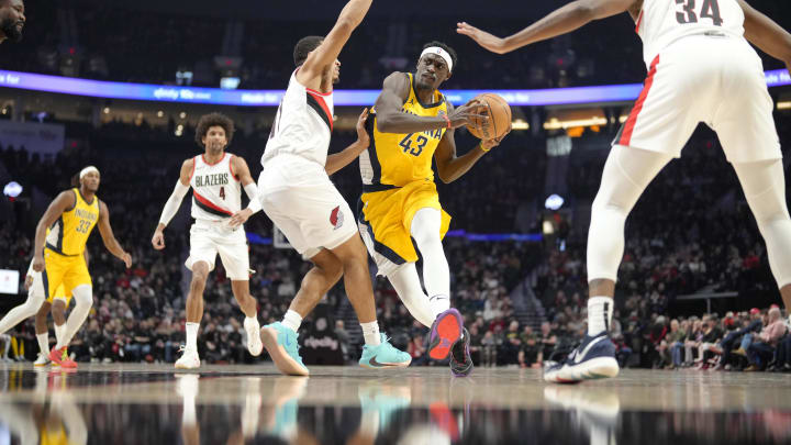 Jan 19, 2024; Portland, Oregon, USA; Indiana Pacers power forward Pascal Siakam (43) drives to the basket against Portland Trail Blazers point guard Malcolm Brogdon (11) during the first half at Moda Center. Mandatory Credit: Soobum Im-USA TODAY Sports