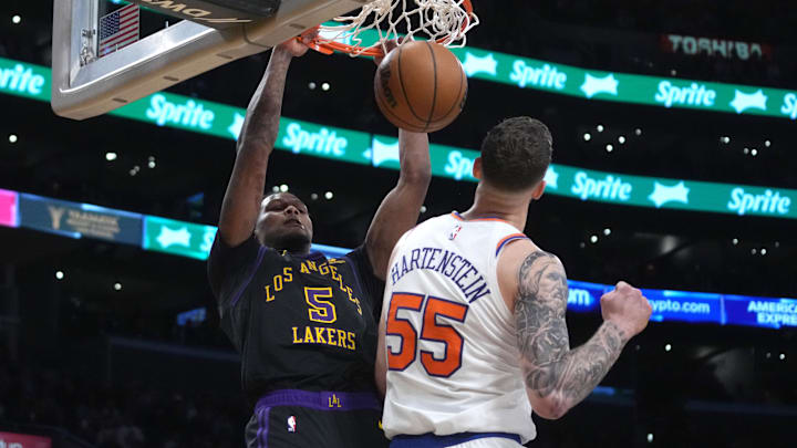 Dec 18, 2023; Los Angeles, California, USA; Los Angeles Lakers forward Cam Reddish (5) dunks the ball against New York Knicks center Isaiah Hartenstein (55) in the second half at Crypto.com Arena. Mandatory Credit: Kirby Lee-Imagn Images Dec 18, 2023; Los Angeles, California, USA; Los Angeles Lakers forward Cam Reddish (5) dunks the ball against New York Knicks center Isaiah Hartenstein (55) in the second half at Crypto.com Arena. Mandatory Credit: Kirby Lee-Imagn Images