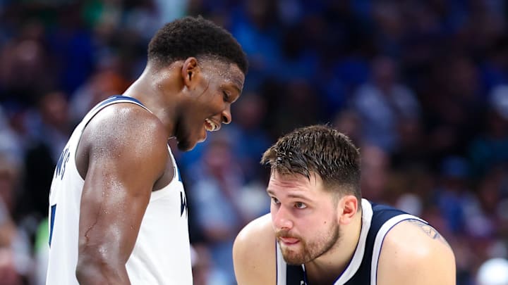 May 28, 2024; Dallas, Texas, USA; Minnesota Timberwolves guard Anthony Edwards (5) speaks to Dallas Mavericks guard Luka Doncic (77) during the fourth quarter during game four of the western conference finals for the 2024 NBA playoffs at American Airlines Center. Mandatory Credit: Kevin Jairaj-Imagn Images