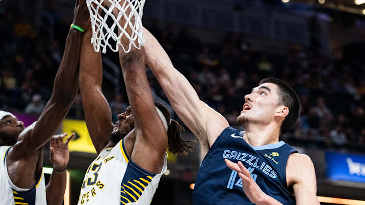 Memphis Grizzlies center Zach Edey (14) shoots the ball while Indiana Pacers center Myles Turner (33) defends in the first half at Gainbridge Fieldhouse. Mandatory Credit: Trevor Ruszkowski-Imagn Images