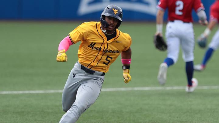 West Virginia Mountaineers junior Armani Guzman (5) rounds second base against Kansas Jayhawks during the game inside Hoglund Ballpark on May 10, 2026.