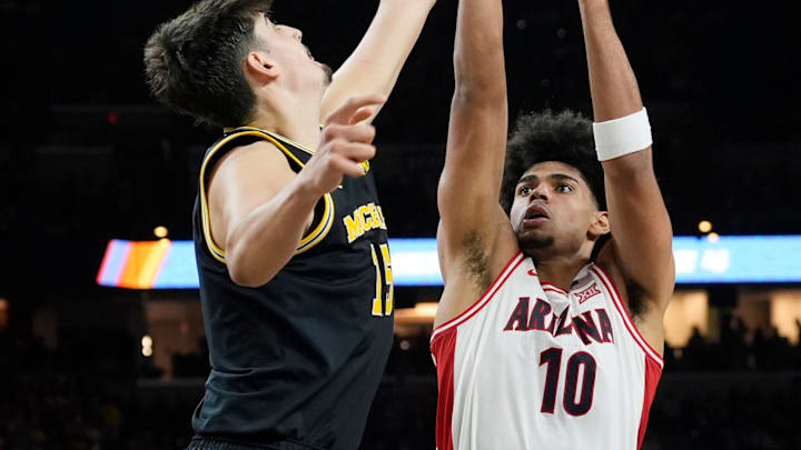 Michigan center Aday Mara (15) blocks Arizona forward Koa Peat (10) shot in the second half of their Final Four game at Lucas Oil Stadium in Indianapolis on Saturday, April 4, 2026.