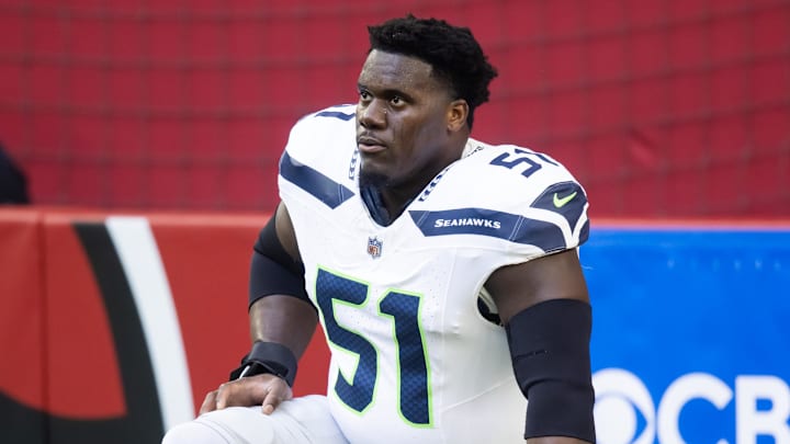 Dec 8, 2024; Glendale, Arizona, USA; Seattle Seahawks center Olu Oluwatimi (51) against the Arizona Cardinals at State Farm Stadium. Dec 8, 2024; Glendale, Arizona, USA; Seattle Seahawks center Olu Oluwatimi (51) against the Arizona Cardinals at State Farm Stadium.