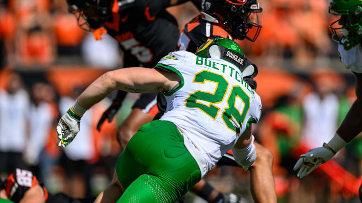 Sep 14, 2024; Corvallis, Oregon, USA; Oregon Ducks linebacker Bryce Boettcher (28) tackles Oregon State Beavers wide receiver Zachary Card (12) during the second half at Reser Stadium. Mandatory Credit: Craig Strobeck-Imagn Images Sep 14, 2024; Corvallis, Oregon, USA; Oregon Ducks linebacker Bryce Boettcher (28) tackles Oregon State Beavers wide receiver Zachary Card (12) during the second half at Reser Stadium. Mandatory Credit: Craig Strobeck-Imagn Images