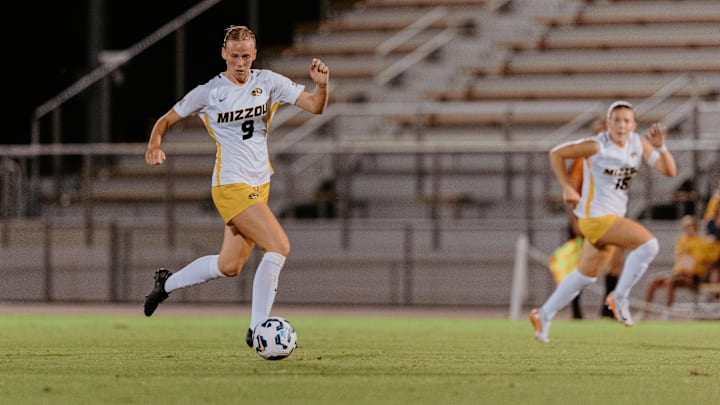 Missouri senior midfielder Milena Fischer attempts a shot at goal that falls just wide.