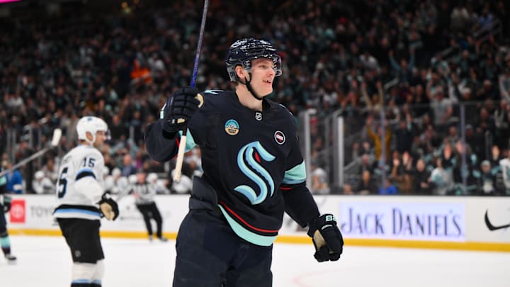 Mar 14, 2025; Seattle, Washington, USA; Seattle Kraken right wing Kaapo Kakko (84) celebrates after scoring a goal against the Utah Hockey Club during the third period at Climate Pledge Arena. Mandatory Credit: Steven Bisig-Imagn Images