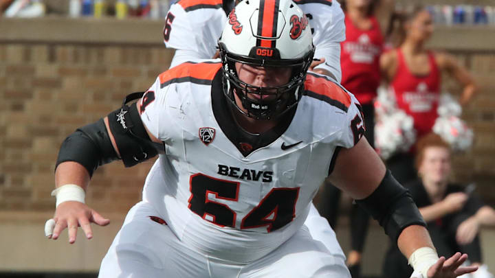 Sep 13, 2025; Lubbock, Texas, USA;  Oregon State Beavers offensive lineman Ryan Berger (65) blocks against the Texas Tech Red Raiders in the first half at Jones AT&T Stadium. Mandatory Credit: Michael C. Johnson-Imagn Images
