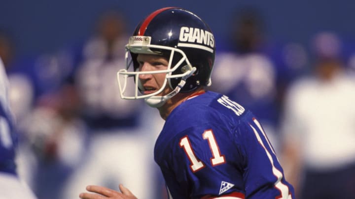 Sep 13, 1992; East Rutherford, NJ, USA; FILE PHOTO; New York Giants quarterback (11) Phil Simms in action against the Dallas Cowboys at Giants Stadium.  
