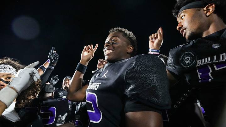 Brownsburg Bulldogs Branden Sharpe (12) celebrates with his teammates Friday, Sept. 11, 2026, after a game at Brownsburg High School in Brownsburg, Ind. The Bulldogs defeated the Orioles, 49-7.