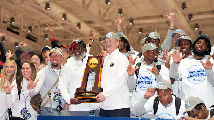 Mar 9, 2024; Boston, MA, USA; Members of the Texas Tech Red Raiders men's team and coach Wes Kittley