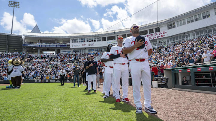 Minnesota Twins coaches and players during the national anthem before the start of their game against the New York Yankees at Lee Health Sports Complex in Fort Myers, Fla., on Feb. 25, 2025.