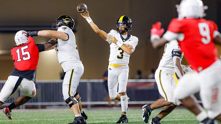 American Heritage quarterback Dia Bell throws against Milton (Georgia) in an August 2024 matchup. Milton won that game 37-28.