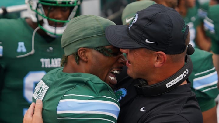 Tulane Green Wave head coach Jon Sumrall and wide receiver Shazz Preston celebrate together.