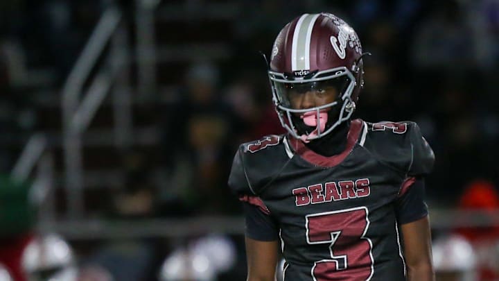 Lawrence Central Terry Walker III (3) looks to the coach for the next play as Lawrence North took on Lawrence Central in the S6 IHSAA high school football sectional semifinal.