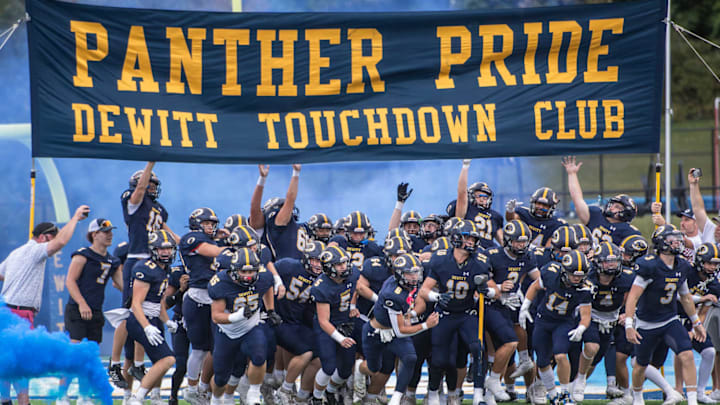 DeWitt high school football runs onto the field in a against against Hurricane on September 20.