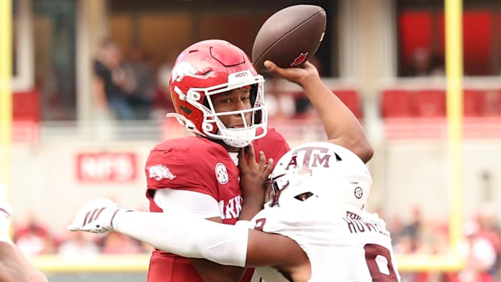 Arkansas Razorbacks quarterback KJ Jackson (7) attempts a pass in the first quarter as Texas A&M Aggies defensive end Cashius Howell (9) defends at Donald W. Reynolds Razorback Stadium. Arkansas Razorbacks quarterback KJ Jackson (7) attempts a pass in the first quarter as Texas A&M Aggies defensive end Cashius Howell (9) defends at Donald W. Reynolds Razorback Stadium.
