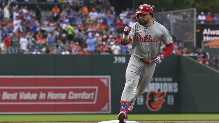 Jun 14, 2024; Baltimore, Maryland, USA;  Philadelphia Phillies designated hitter Kyle Schwarber (12) point to teammates after hitting a solo home run in in the first inning against the Baltimore Orioles at Oriole Park at Camden Yards. 