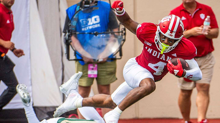 Indiana's Myles Price (4) runs after the catch against Charlotte at Memorial Stadium.