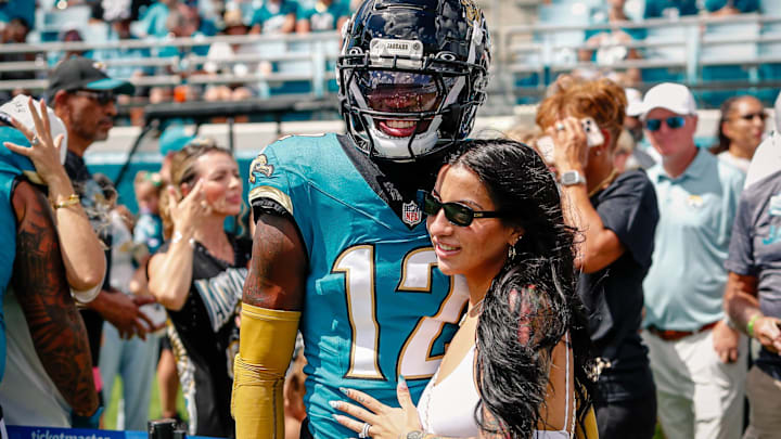 Sep 21, 2025; Jacksonville, Florida, USA; Jacksonville Jaguars player Travis Hunter (12) with his wife during pregame against the Houston Texans at EverBank Stadium. Sep 21, 2025; Jacksonville, Florida, USA; Jacksonville Jaguars player Travis Hunter (12) with his wife during pregame against the Houston Texans at EverBank Stadium.