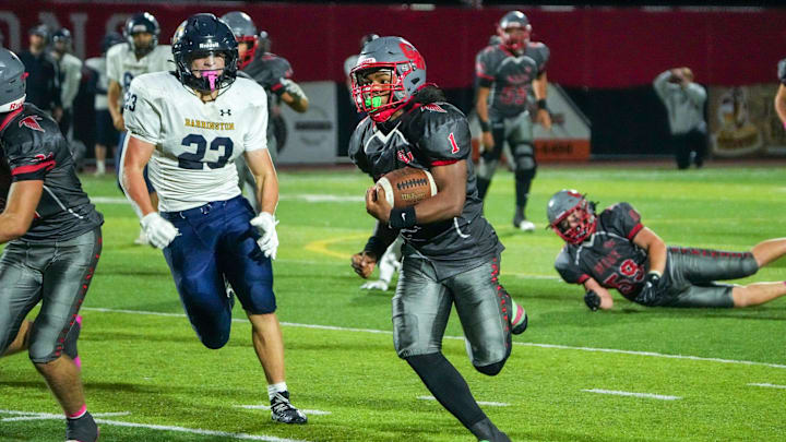 Junior tailback Mehkhai Taylor (1) darts to the end zone for a go-ahead, fourth quarter touchdown in Cranston West's 14-7 win over Barrington over the weekend.