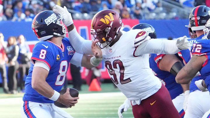 Nov 3, 2024; East Rutherford, New Jersey, USA; Washington Commanders defensive end Dorance Armstrong (92) is called for a personal foul while trying to sack New York Giants quarterback Daniel Jones (8) in the 2nd half at MetLife Stadium.  