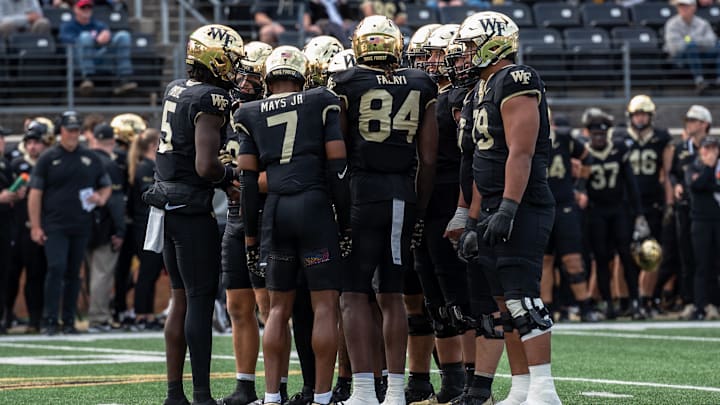 The Wake Forest offense huddles before its drive against the SMU Mustangs on Saturday, Oct. 25, 2025, at Allegacy Federal Credit Union Stadium in Winston-Salem, North Carolina. The Wake Forest offense huddles before its drive against the SMU Mustangs on Saturday, Oct. 25, 2025, at Allegacy Federal Credit Union Stadium in Winston-Salem, North Carolina.