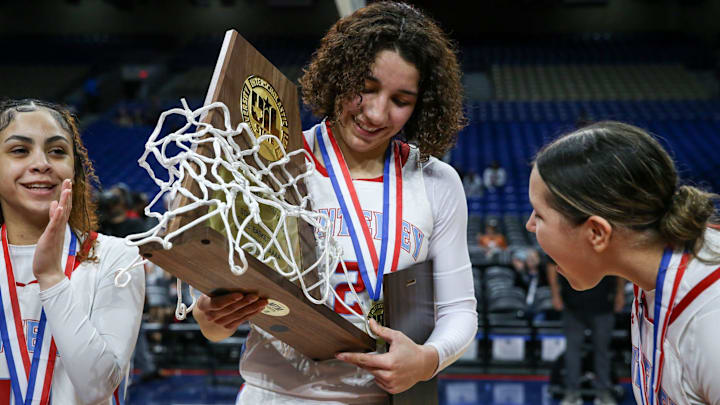 Monterey's Aaliyah Chavez holds the Class 5A Division II state championship girls basketball trophy on Saturday, March 1, 2025, at the Alamodome in San Antonio. Monterey defeated Liberty Hill 64-35.