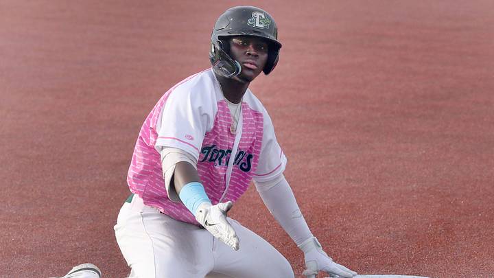 Daytona Tortugas Hector Rodriguez  #25 gestures to his team mates in the dugout after sliding into thrid on a triple against Palm Beach Cardinals, Tuesday June 20, 2023 at Jackie Robinson Ballpark.