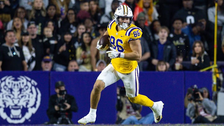 LSU Tigers tight end Mason Taylor (86) runs after a catch against the Vanderbilt Commodores during the first half at Tiger Stadium. 