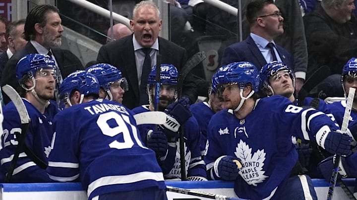 May 5, 2025; Toronto, Ontario, CAN; Toronto Maple Leafs head coach Craig Berube (center) talks to his players after a Florida Panthers goal during the third period of game one of the second round of the 2025 Stanley Cup Playoffs at Scotiabank Arena. Mandatory Credit: John E. Sokolowski-Imagn Images