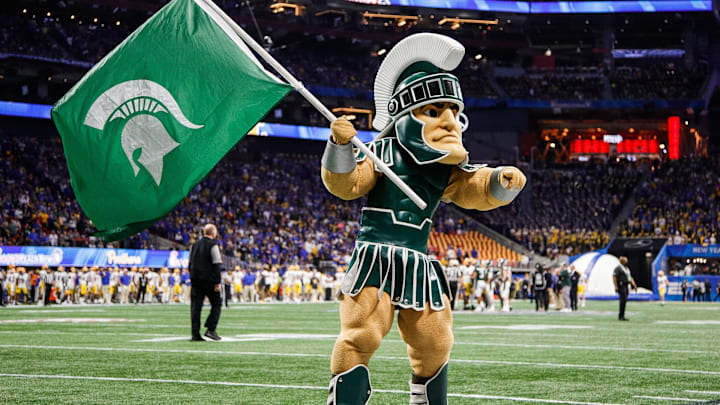 Sparty cheer for Michigan State before kickoff of the Peach Bowl at the Mercedes-Benz Stadium in Atlanta, Ga. on Dec. 30, 2021.