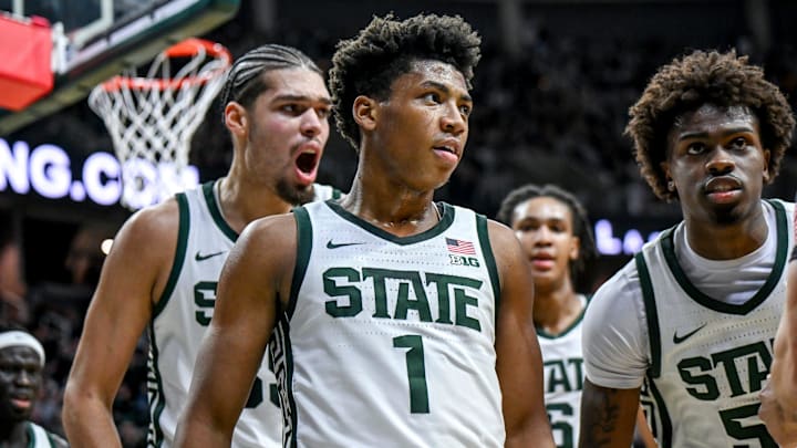 Michigan State's Jeremy Fears Jr., center, leaves the court with Jesse McCulloch, left, and Coen Carr, right, after Fears' shot to end the first half against Cornell on Monday, Dec. 29, 2025, at the Breslin Center in East Lansing.