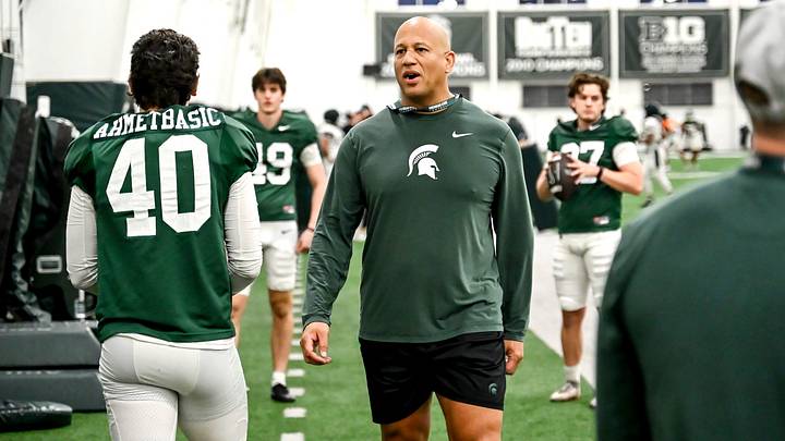 Michigan State's assistant head coach/special teams coordinator LeVar Woods talks with Tarik Ahmetbasic, left, and other on special teams during spring football practice on Tuesday, April 14, 2026, in East Lansing.
