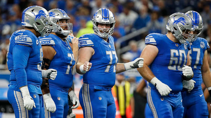 Detroit Lions center Frank Ragnow (77), center, fist bumps the offensive line before a play against Atlanta Falcons during the first half at Ford Field in Detroit on Sunday, Sept. 24, 2023.
