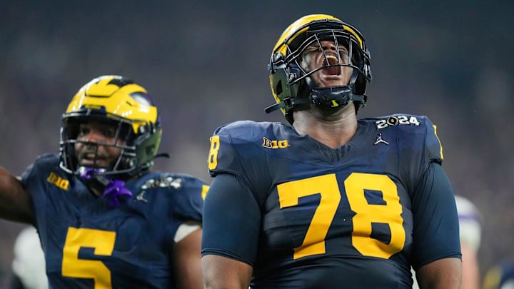 Michigan defensive lineman Kenneth Grant celebrates a sack on Washington quarterback Michael Penix Jr. during the College Football Playoff national championship game against Washington at NRG Stadium in Houston, Texas, on Monday, Jan. 8, 2024.