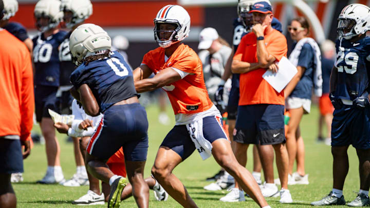 Auburn Tigers quarterback Deuce Knight (9) hands the ball off to running back Damari Alston (0) during practice at Woltosz Football Performance Center in Auburn, Ala. on Thursday, Aug. 14, 2025.