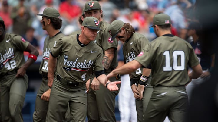 Vanderbilt Commodores head coach Tim Corbin (4) shakes hands with his players during introductions as Ole Miss Rebels take on Vanderbilt Commodores during the SEC baseball tournament championship game at Hoover Met in Birmingham, Ala., on Sunday, May 25, 2025. Vanderbilt Commodores head coach Tim Corbin (4) shakes hands with his players during introductions as Ole Miss Rebels take on Vanderbilt Commodores during the SEC baseball tournament championship game at Hoover Met in Birmingham, Ala., on Sunday, May 25, 2025.