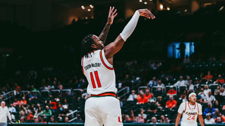Miami Forward AJ Staton Mccray shooting a three pointer against Binghamton.