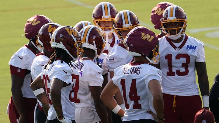 Jul 29, 2026; Ashburn, VA, USA; Washington Commanders wide receivers huddle after a drill on day one of training camp at BigBear.ai Performance Center at Commanders Park. Mandatory Credit: Geoff Burke-Imagn Images Jul 29, 2026; Ashburn, VA, USA; Washington Commanders wide receivers huddle after a drill on day one of training camp at BigBear.ai Performance Center at Commanders Park. Mandatory Credit: Geoff Burke-Imagn Images