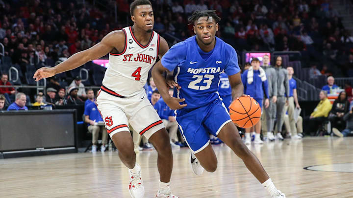 Dec 30, 2023; Elmont, New York, USA;  Hofstra Pride guard Tyler Thomas (23) drives to the rim against St. John's. 