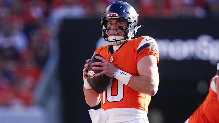Nov 16, 2025; Denver, Colorado, USA;  Denver Broncos quarterback Bo Nix (10) looks to pass during the first quarter of the game against the Kansas City Chiefs at Empower Field at Mile High. 