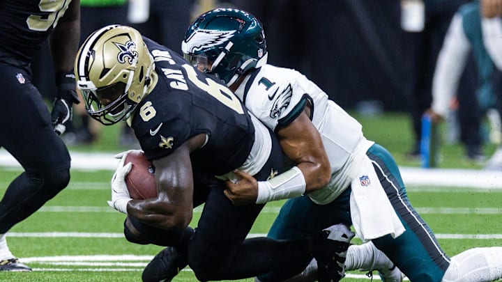 Sep 22, 2024; New Orleans, Louisiana, USA; New Orleans Saints linebacker Willie Gay (6) recovers a fumble by Philadelphia Eagles quarterback Jalen Hurts (1) during the first half at Caesars Superdome. Mandatory Credit: Stephen Lew-Imagn Images Sep 22, 2024; New Orleans, Louisiana, USA; New Orleans Saints linebacker Willie Gay (6) recovers a fumble by Philadelphia Eagles quarterback Jalen Hurts (1) during the first half at Caesars Superdome. Mandatory Credit: Stephen Lew-Imagn Images