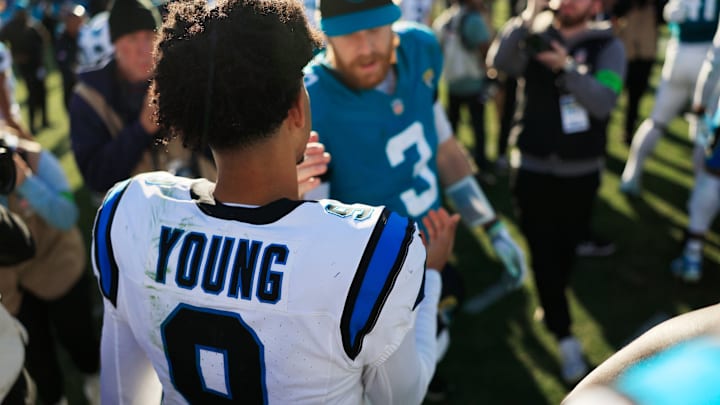 Carolina Panthers quarterback Bryce Young (9) shakes hands with Jacksonville Jaguars quarterback C.J. Beathard (3) after the game of a regular season NFL football matchup Sunday, Dec. 31, 2023 at EverBank Stadium in Jacksonville, Fla. The Jacksonville Jaguars blanked the Carolina Panthers 26-0.